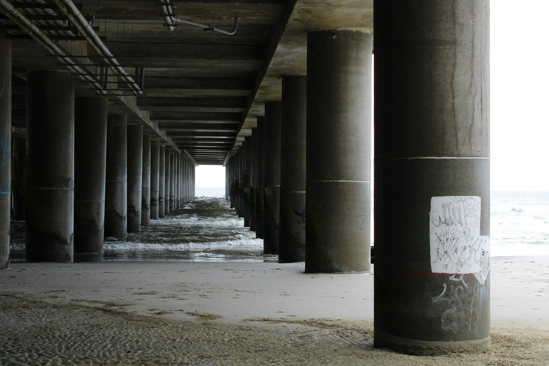 gray concrete tunnel during daytime